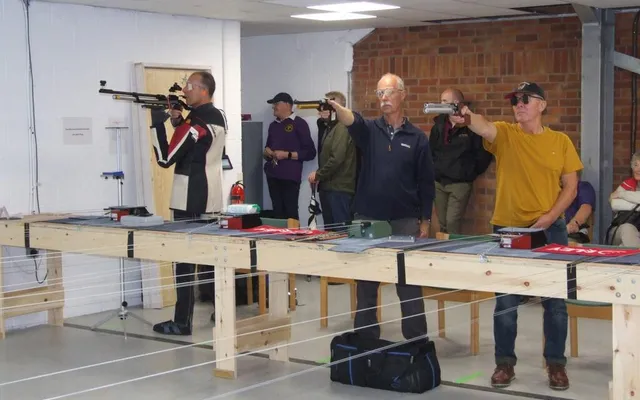 Air pistol shooter at the firing line — Pinhoe TSC.
