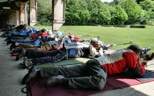 Prone rifle shooter on the firing line — Pinhoe TSC.